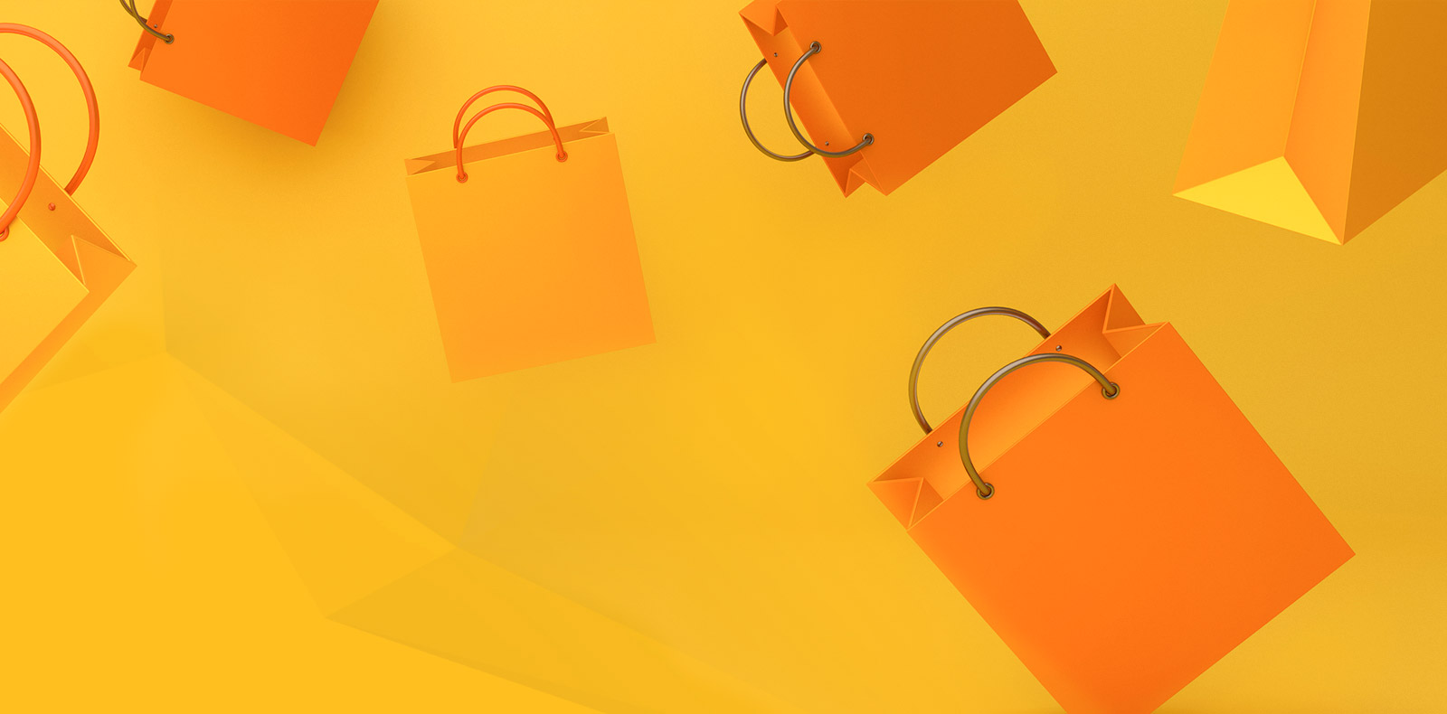Orangene und gelbe Einkaufstaschen auf gelben Hintergrund